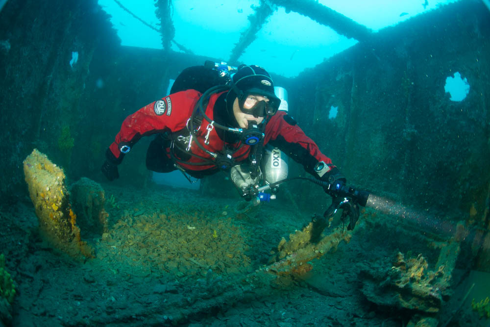 properly weighted diver floats through a wreck
