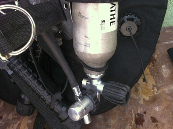 hose routing for dry suit inflation regulator