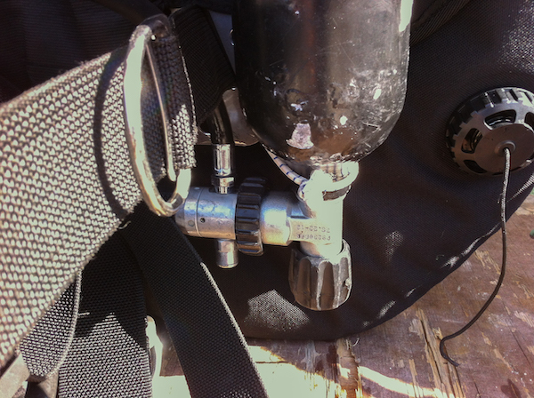 hose routing for dry suit inflation regulator